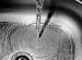 Faucet pouring water into sink.