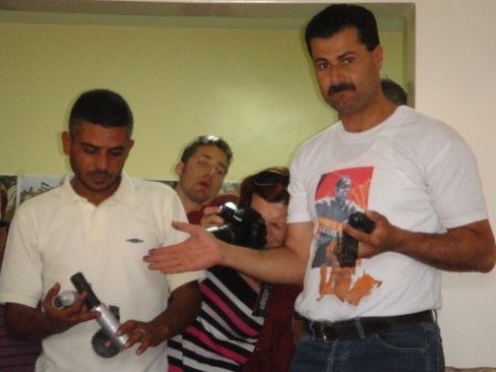 Abdallah Abu Rahma (right), telling us what ammunition to watch for from the Israeli Army before we set off for the weekly demonstration in Bil'in. He is now in prison.