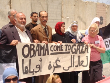 A message to Obama held by the family whose home was being "protected" by Rachel Corrie, who was killed in 2003 when an Israeli bulldozer ran over her.